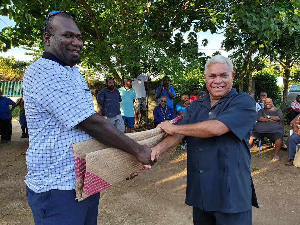Luganville MP Marc Ati (left) presenting VP President with a mat